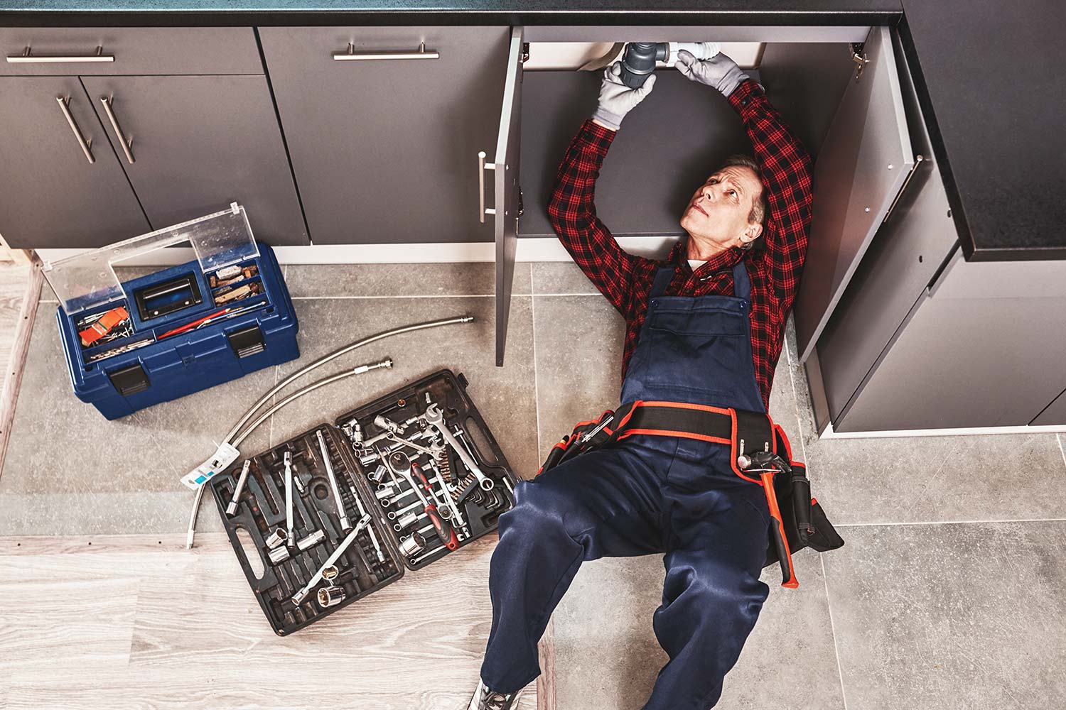 tools-case-top-view-of-seniour-handyman-repairing-resize
